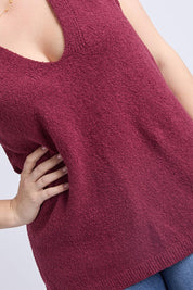 A model wearing the Bowie Cotton Blend Knit Vest in colour Plum (Red), from the front, cropped image