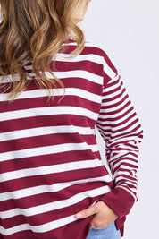 A model wearing the All Sorts Cotton Crew in colour Plum (Red), from the front, cropped image