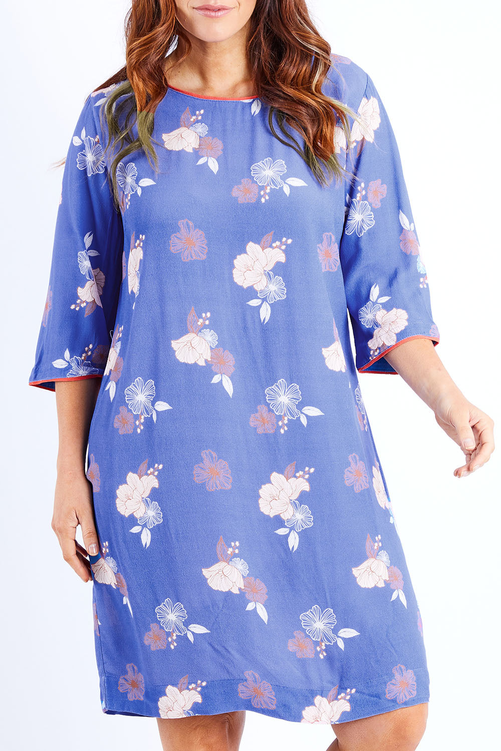 Model Laura wearing size 12 of the Botanical Shift Dress in colour Botanflora (Blue), from the front, cropped image