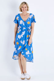Model Veronica wearing size 10 of the Petal Floral Wrap Dress in colour Petal (Blue), from the front, showing the whole outfit
