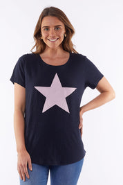 A model wearing the Starry Eyed Tee in colour Navy (Blue), from the front, cropped image