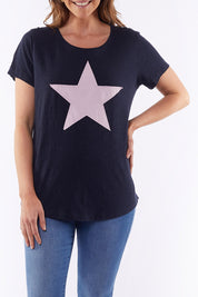 A model wearing the Starry Eyed Tee in colour Navy (Blue), from the front, cropped image