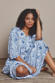 Model Ziara wearing size 10 of the Dolce Tile Cotton Blend Midi Dress in colour Oceantile (Blue), from the front, cropped image