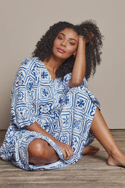 Model Ziara wearing size 10 of the Dolce Tile Cotton Blend Midi Dress in colour Oceantile (Blue), from the front, cropped image