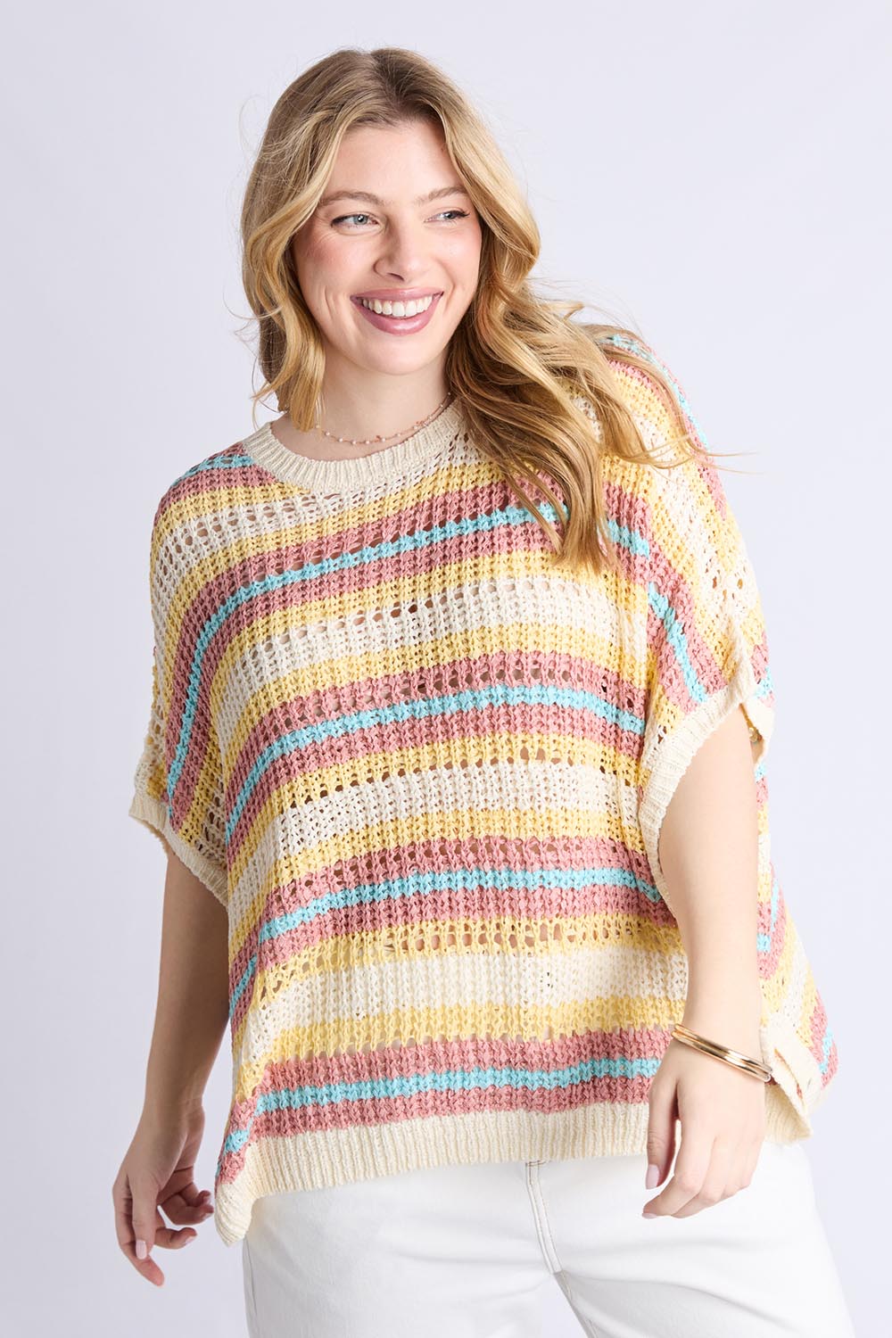 A model wearing the Striped Knit Top in colour Bluestripe, from the front, cropped image