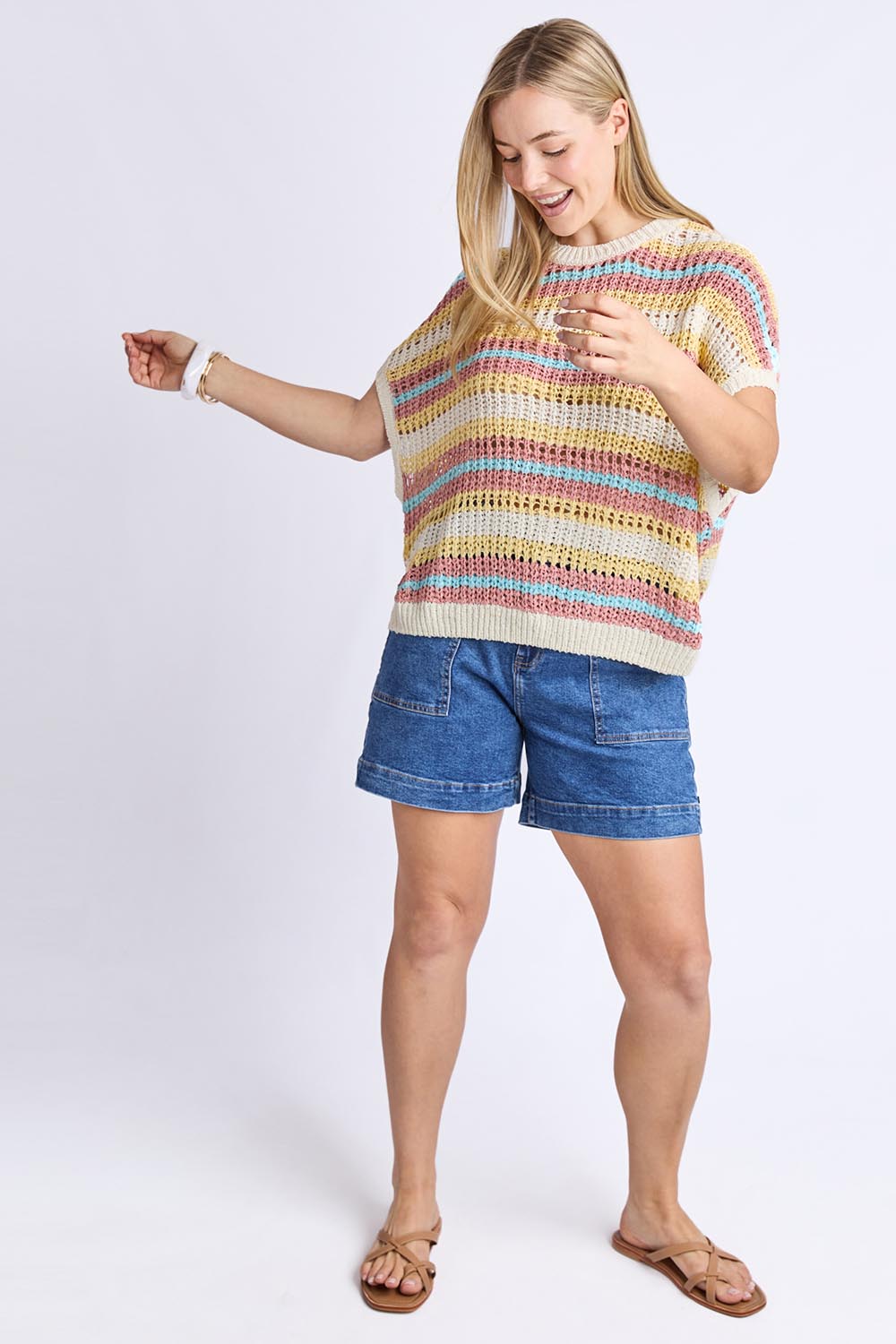 A model wearing the Striped Knit Top in colour Bluestripe, from the front, showing the whole outfit
