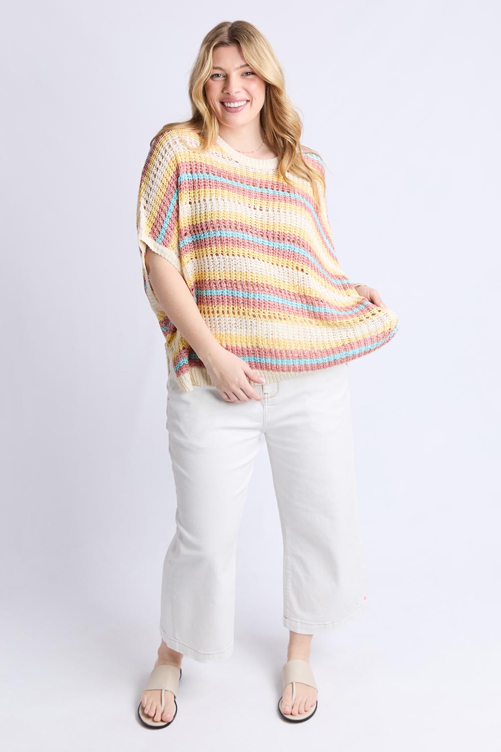 A model wearing the Striped Knit Top in colour Bluestripe, from the front, showing the whole outfit