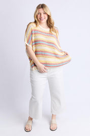 A model wearing the Striped Knit Top in colour Bluestripe, from the front, showing the whole outfit
