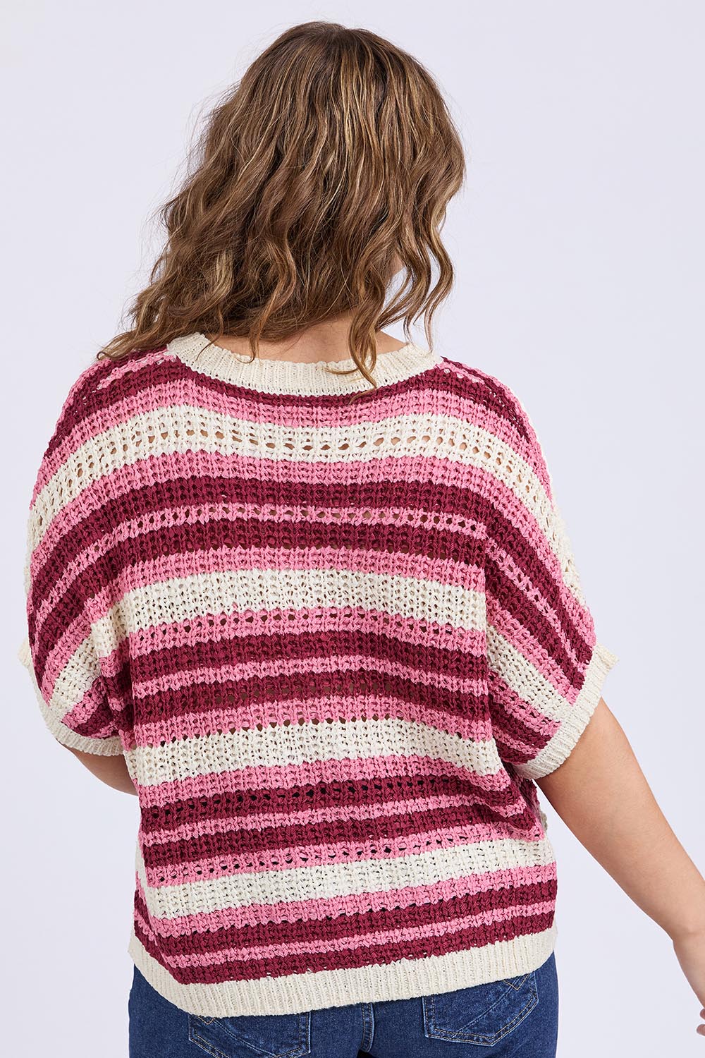 A model wearing the Striped Knit Top in colour Chateauros, from the back
