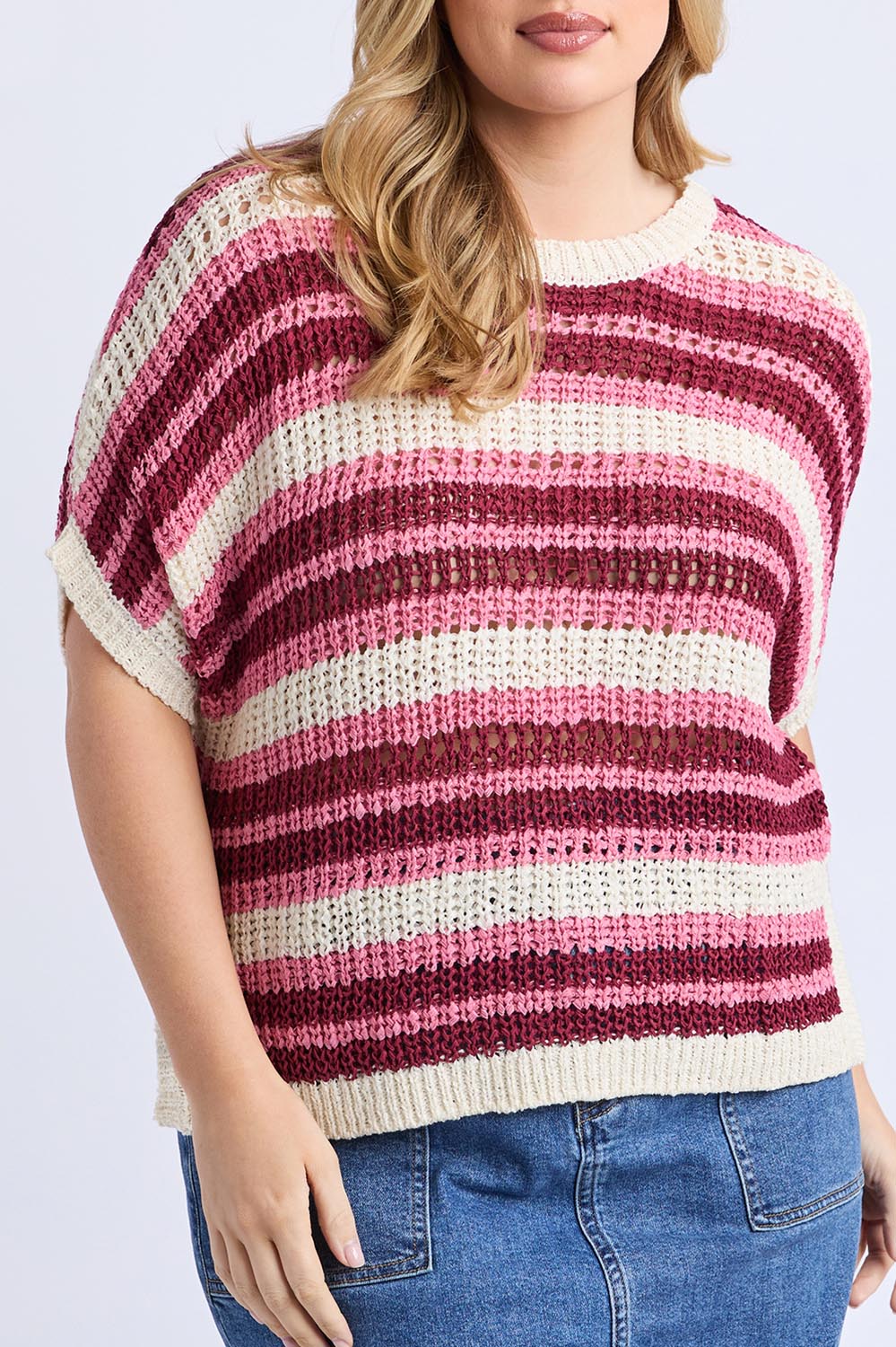 A model wearing the Striped Knit Top in colour Chateauros, from the front, cropped image