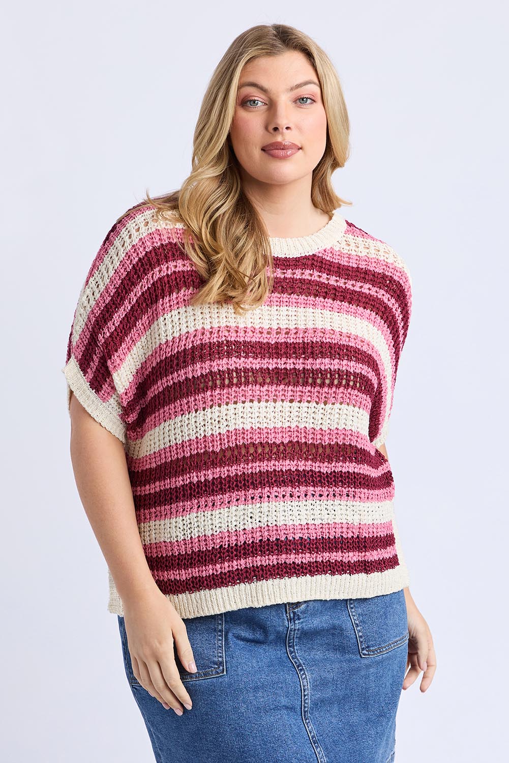 A model wearing the Striped Knit Top in colour Chateauros, from the front, cropped image
