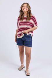 A model wearing the Striped Knit Top in colour Chateauros, from the front, showing the whole outfit