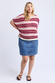 A model wearing the Striped Knit Top in colour Chateauros, from the front, showing the whole outfit