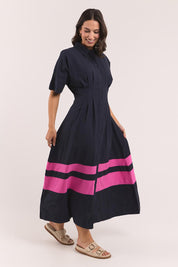 Model Genericm wearing size sample of the Scarlett Dress – Magentastr in colour Magentastr, from the front