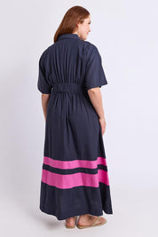 Model Genericm wearing size sample of the Scarlett Dress – Magentastr in colour Magentastr, from the front
