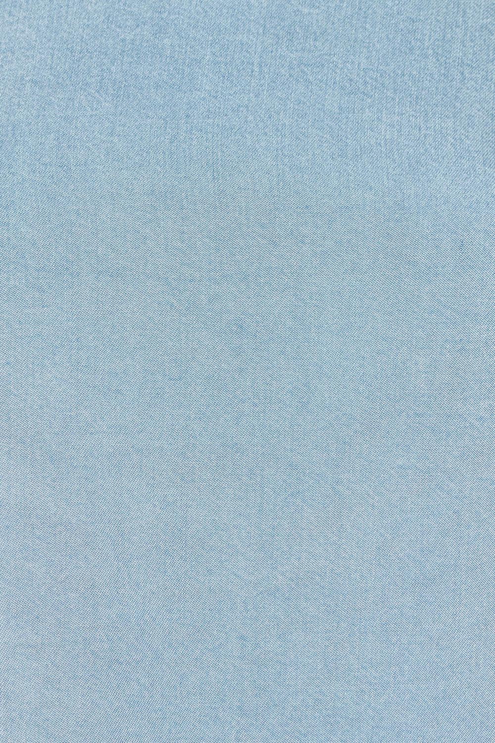 Product shot of the Della Lyocell Chambray Top in colour Midblue (Blue), detail
