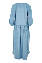 Product shot of the Sawyer Chambray Dress in colour Midblue (Blue), from the back
