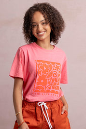 Model Genericm wearing size sample of the Winona Tee – Pinklemon in colour Pinklemon, in a cropped view