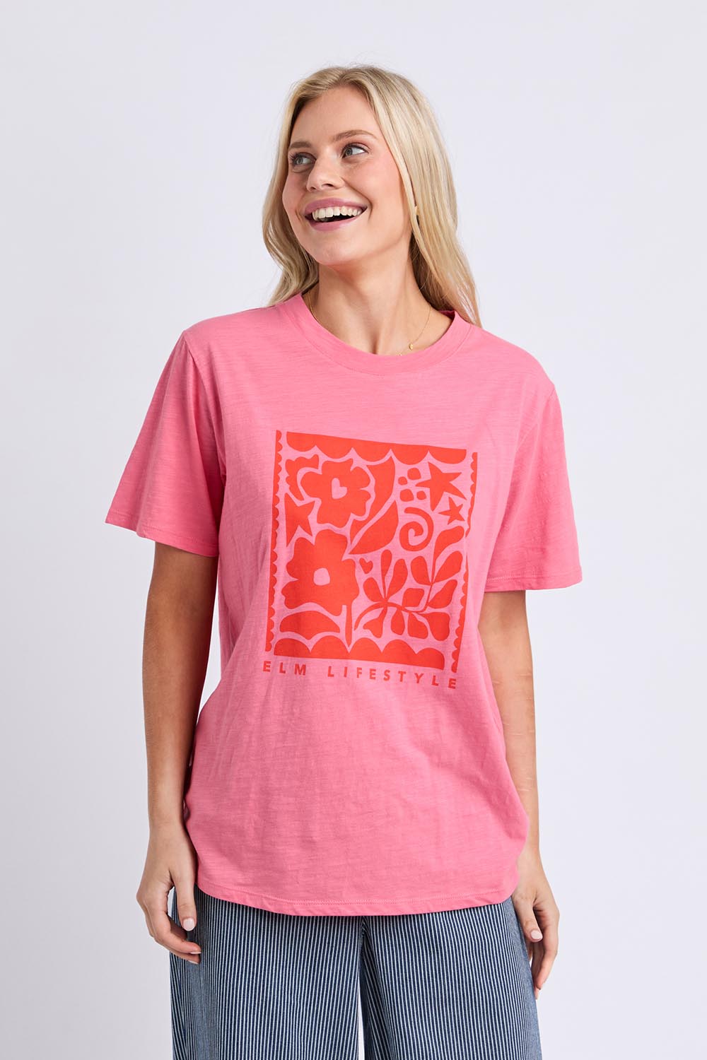 Model Genericm wearing size sample of the Winona Tee – Pinklemon in colour Pinklemon, in a cropped view