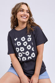 A model wearing the Azalea Cotton Tee in colour Navyazalea, from the front, cropped image