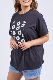 A model wearing the Azalea Cotton Tee in colour Navyazalea, from the front, cropped image