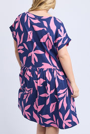A model wearing the Mimosa Cotton Dress in colour Bluedepths, from the back