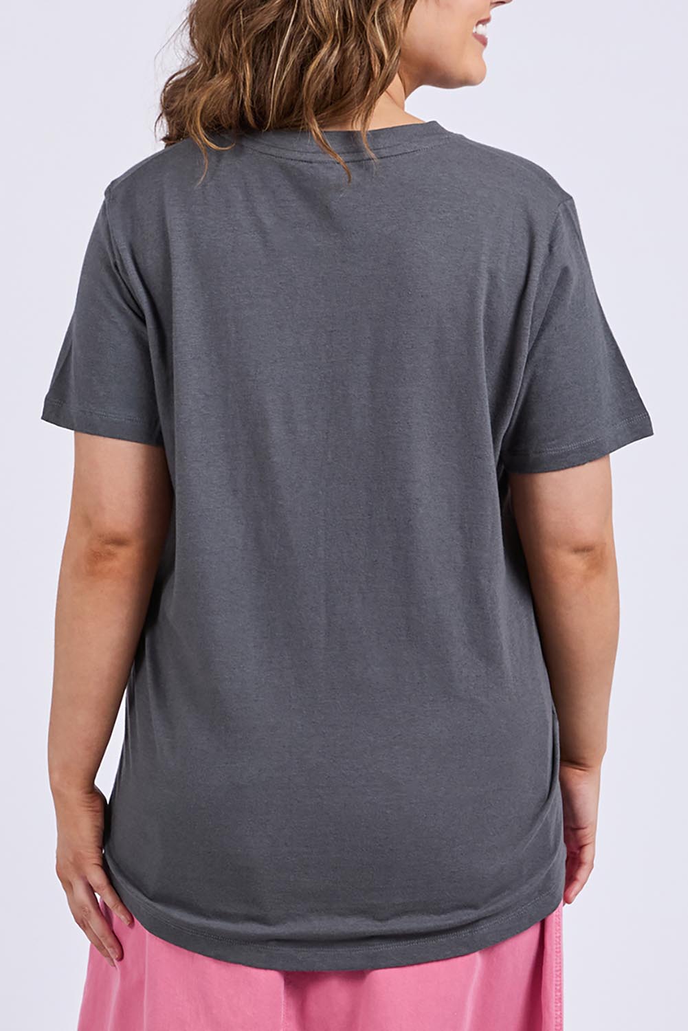 A model wearing the Fiore Cotton Linen Tee in colour Charcoal (Grey), from the back