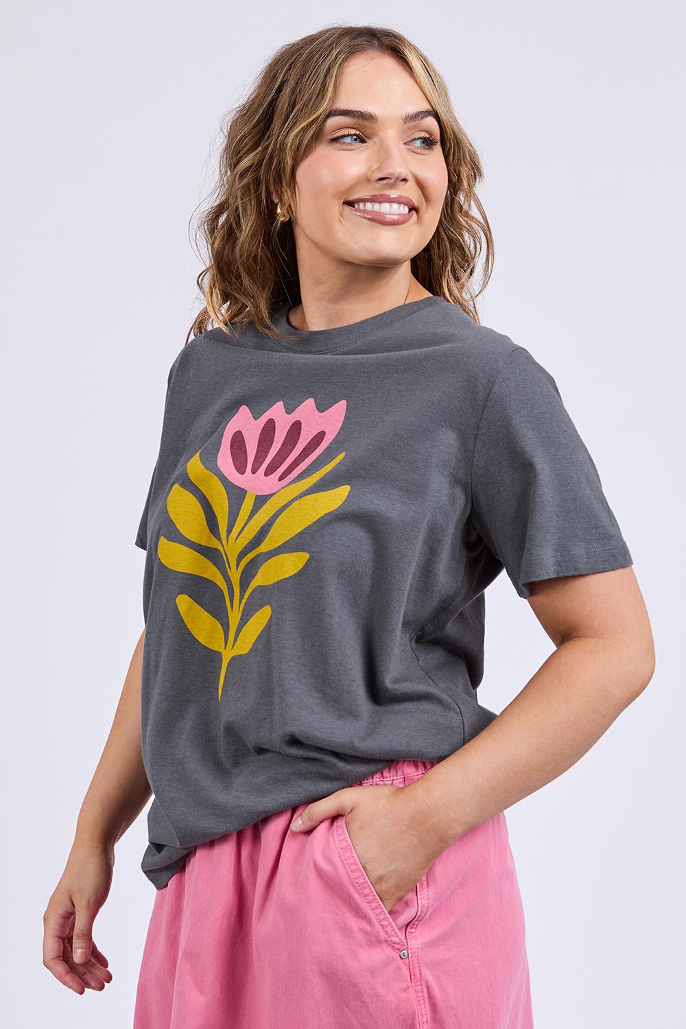 A model wearing the Fiore Cotton Linen Tee in colour Charcoal (Grey), from the front, cropped image