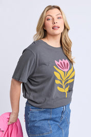 A model wearing the Fiore Cotton Linen Tee in colour Charcoal (Grey), from the front, cropped image