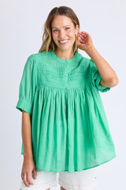 A model wearing the Monty Cotton Short Sleeve Shirt in colour Gumdrop (Green), from the front, cropped image