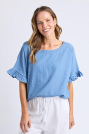 A model wearing the Tilda Chambray Shirt in colour Lightblue (Blue), from the front, cropped image