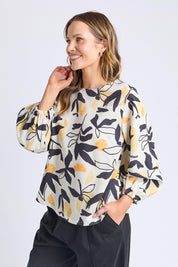 A model wearing the Limone Lyocell Linen Top in colour Limone, from the front, cropped image