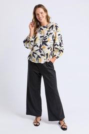 A model wearing the Limone Lyocell Linen Top in colour Limone, from the front, showing the whole outfit