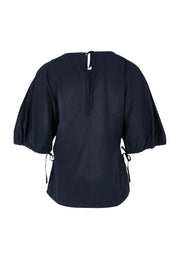 Product shot of the Marie Cotton Top in colour Navy (Blue), from the back