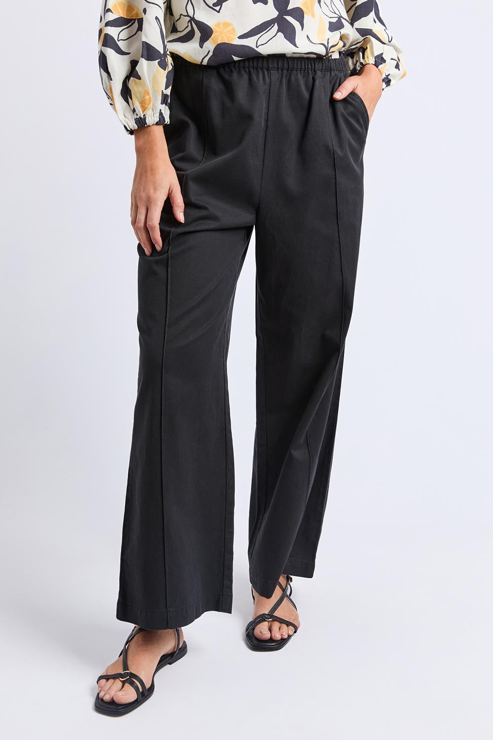 A model wearing the Lucinda Lyocell Cotton Pant in colour Black (Black), from the front, cropped image