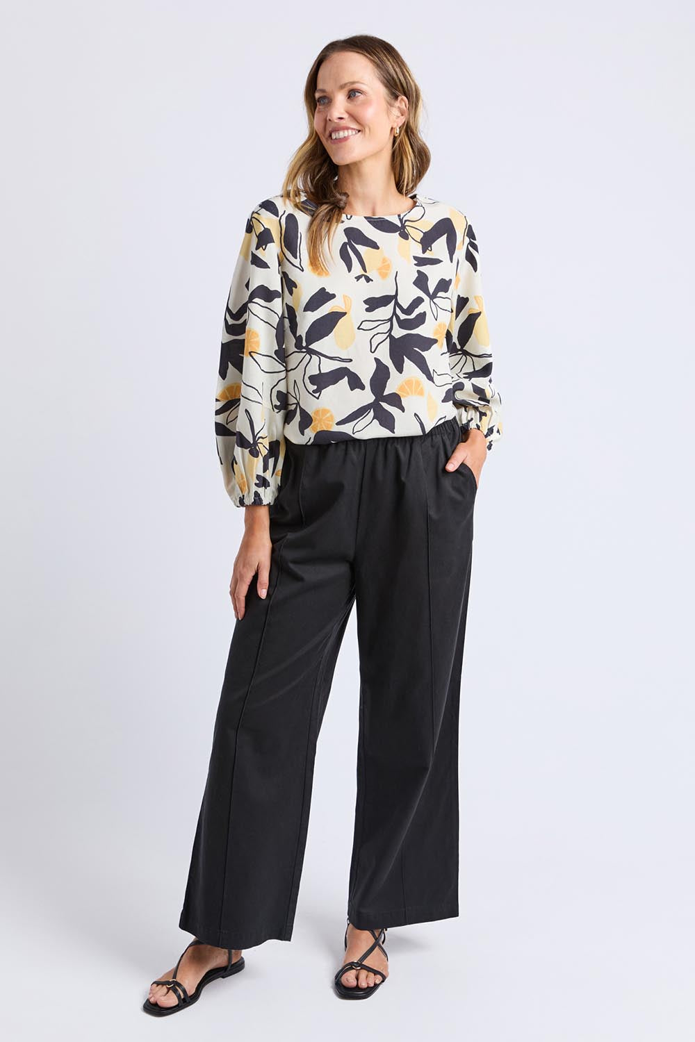 A model wearing the Lucinda Lyocell Cotton Pant in colour Black (Black), from the front, showing the whole outfit