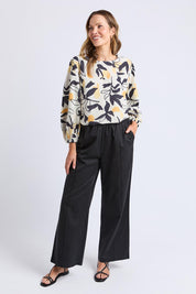 A model wearing the Lucinda Lyocell Cotton Pant in colour Black (Black), from the front, showing the whole outfit