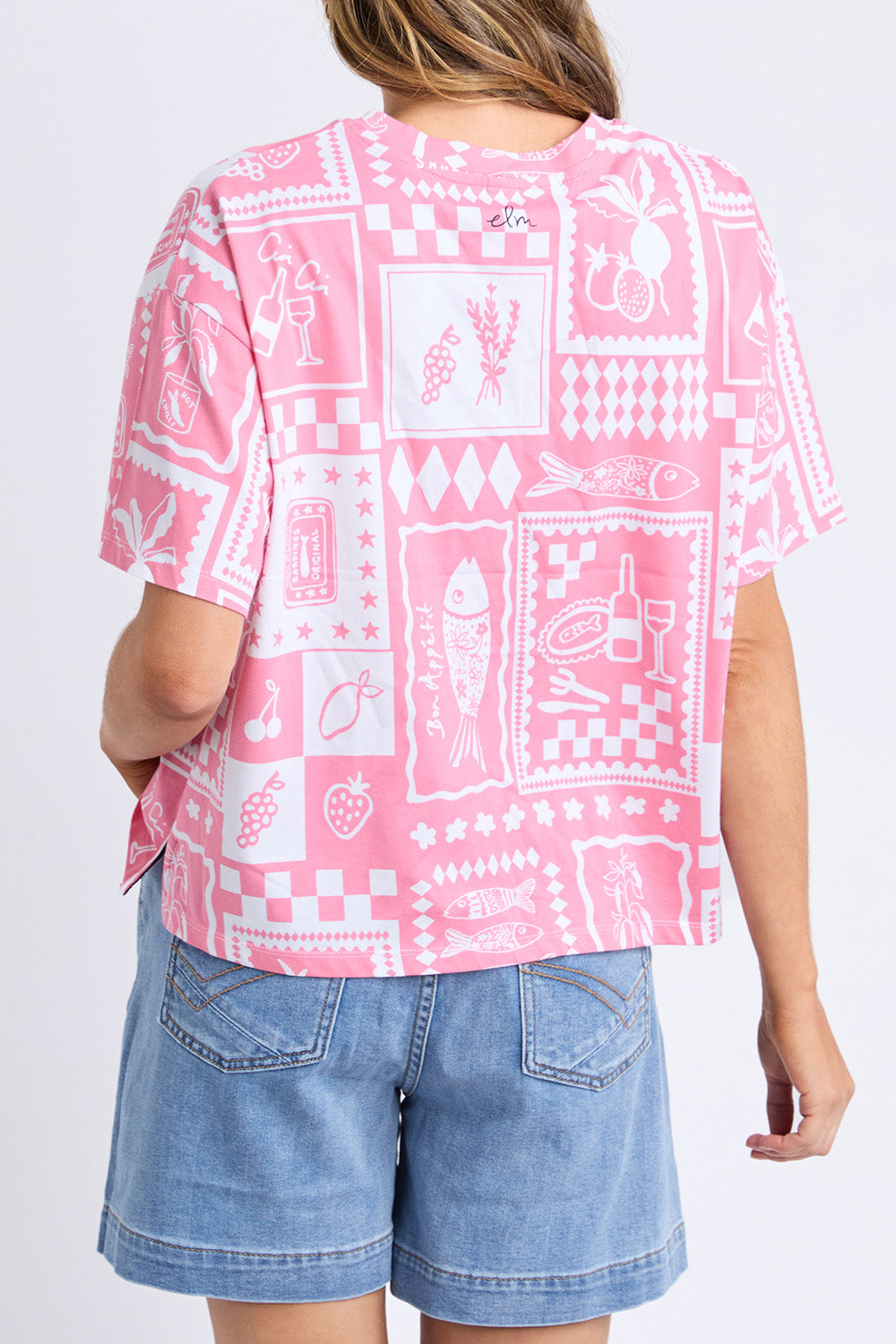 A model wearing the Chin Chin Cotton Tee in colour Print (Blue), from the back