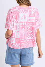 A model wearing the Chin Chin Cotton Tee in colour Print (Blue), from the back