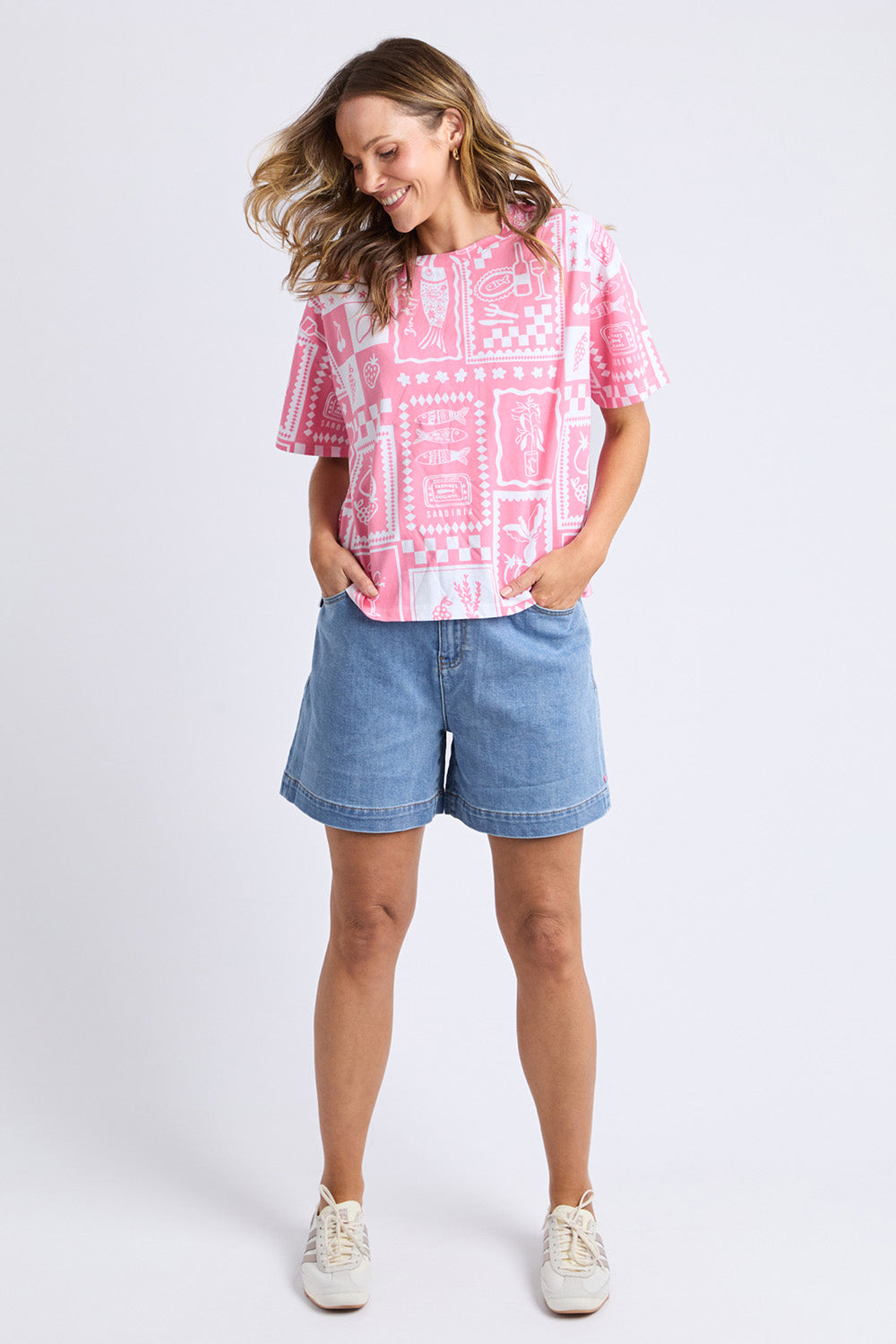 A model wearing the Chin Chin Cotton Tee in colour Print (Blue), from the front, showing the whole outfit