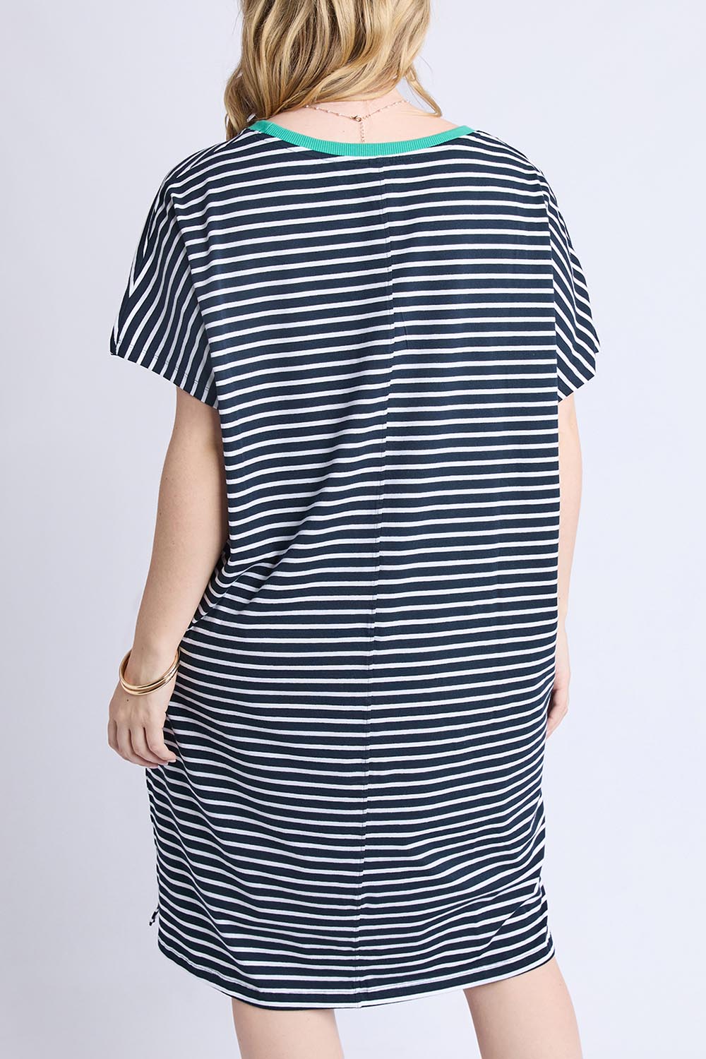 A model wearing the Sabrina Cotton Dress in colour Navywhite, from the back