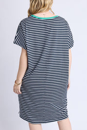 A model wearing the Sabrina Cotton Dress in colour Navywhite, from the back