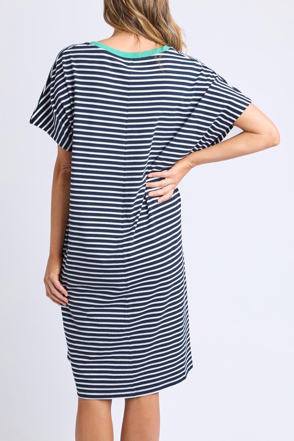 A model wearing the Sabrina Cotton Dress in colour Navywhite, from the back