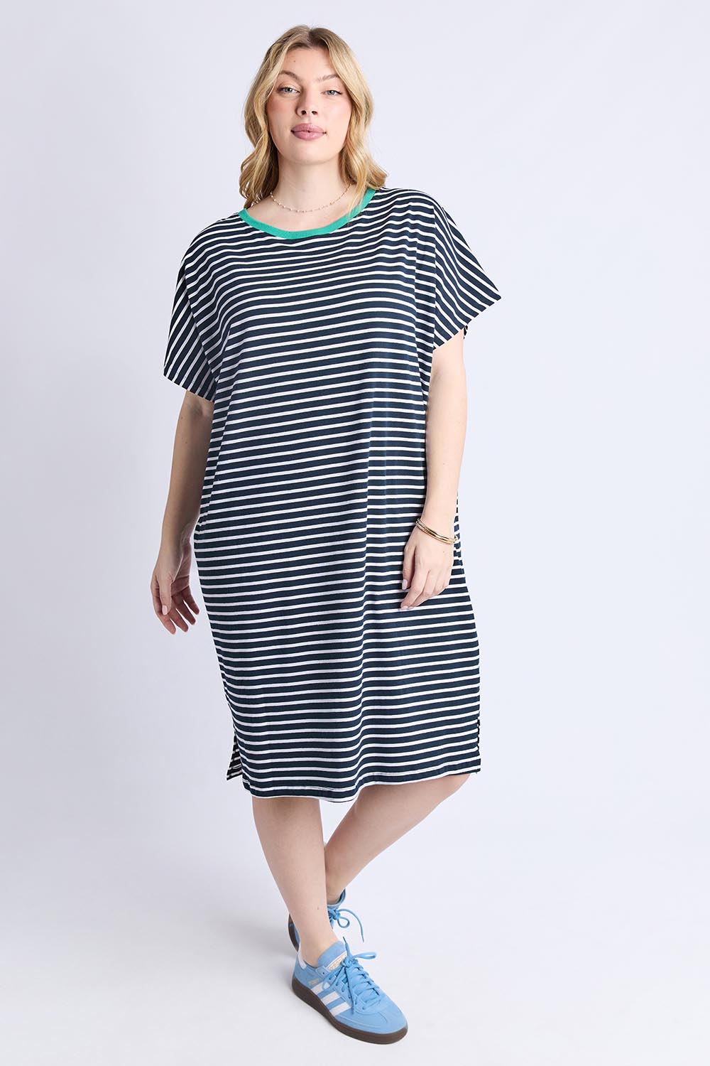 A model wearing the Sabrina Cotton Dress in colour Navywhite, from the front, showing the whole outfit