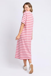A model wearing the Bon Bon Cotton Dress in colour Redpink, from the back