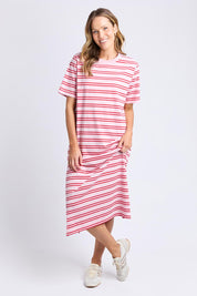 A model wearing the Bon Bon Cotton Dress in colour Redpink, from the front, showing the whole outfit