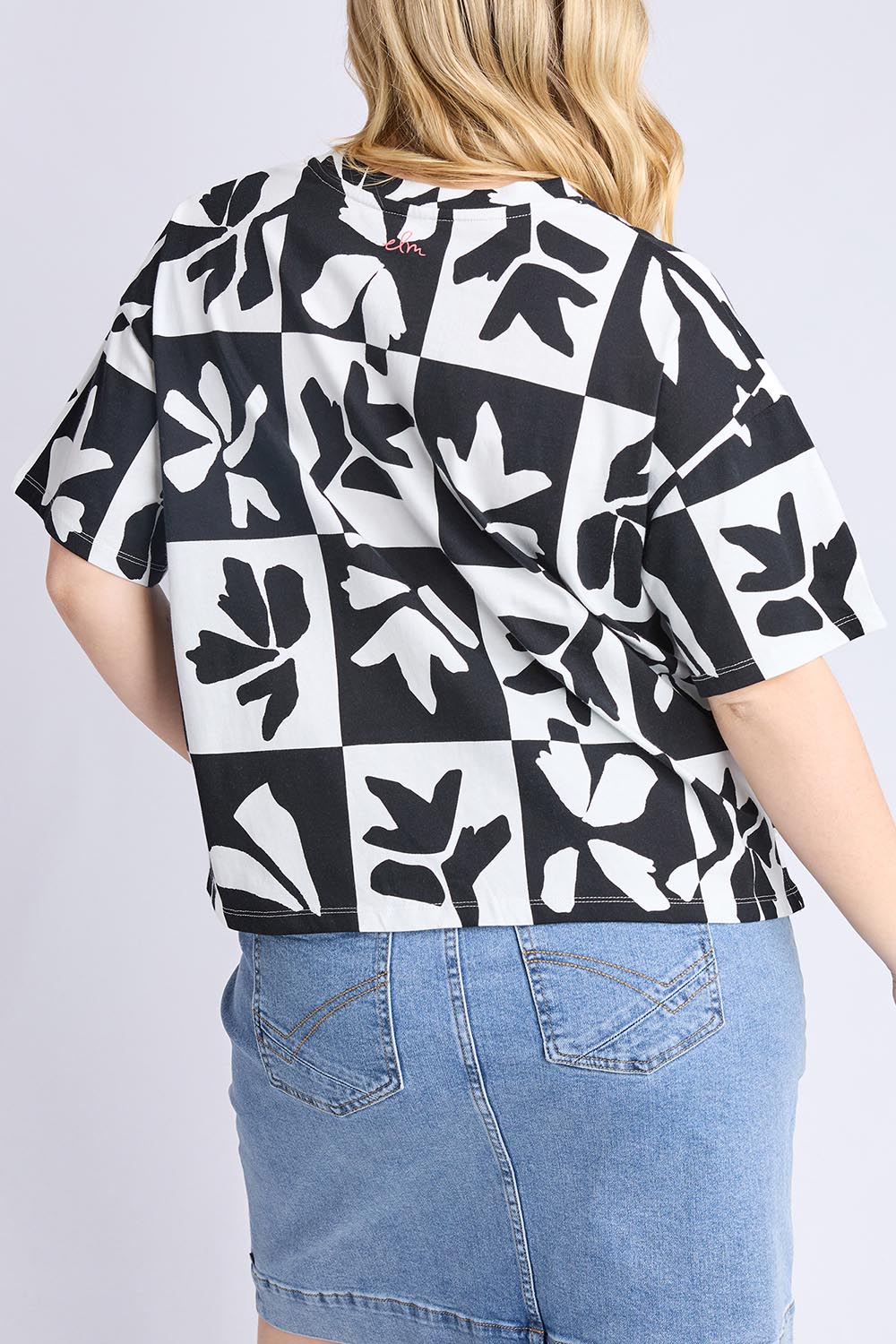 A model wearing the Splice Cotton Tee in colour Blackwhite, from the back