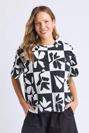 A model wearing the Splice Cotton Tee in colour Blackwhite, from the front, cropped image