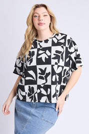 A model wearing the Splice Cotton Tee in colour Blackwhite, from the front, cropped image
