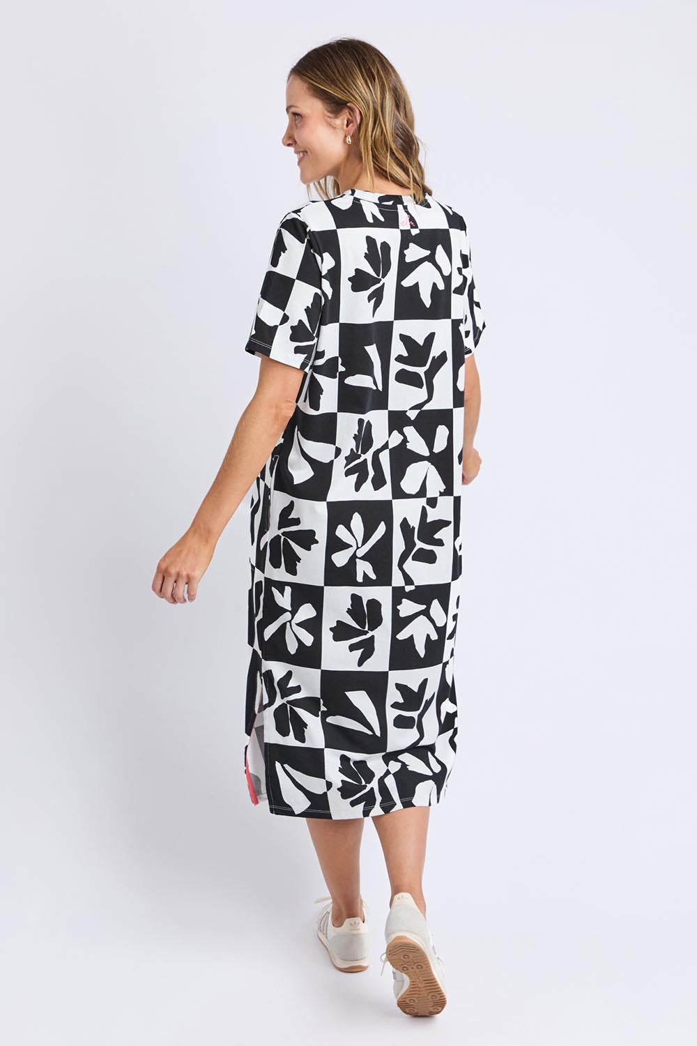 A model wearing the Splice Cotton Dress in colour Blackwhite, from the back